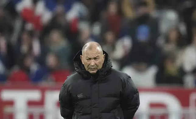 Japan's Eddie Jones watches his players warm-up before the Autumn Nations series rugby union match between France and Japan at the Stade de France in Saint-Denis, outside Paris, Saturday, Nov. 9, 2024. (AP Photo/Christophe Ena)