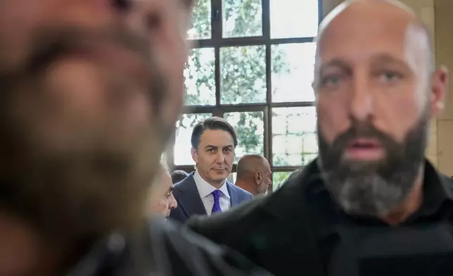 Amos Hochstein, center, a senior adviser to President Joe Biden, is escorted by bodyguards as he leaves his meeting with Parliament Speaker Nabih Berri, in Beirut, Lebanon, Tuesday, Nov. 19, 2024. (AP Photo/Hassan Ammar)