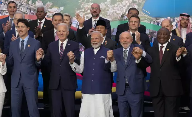 World leaders attending the G20 Summit pose for a group photo in Rio de Janeiro, Tuesday, Nov. 19, 2024. (AP Photo/Eraldo Peres)