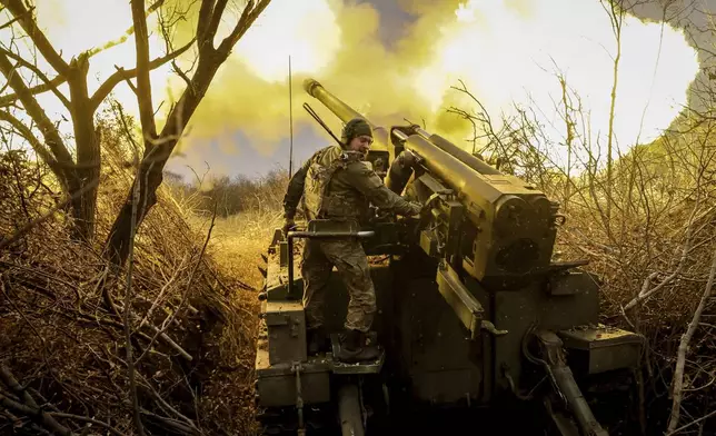 In this photo provided by Ukraine's 24th Mechanised Brigade press service, servicemen of the 24th Mechanised Brigade fire 2s5 self-propelled 152mm howitzer towards Russian positions near Chasiv Yar, Donetsk region, Ukraine, Monday, Nov. 18, 2024. (Oleg Petrasiuk/Ukrainian 24th Mechanised Brigade via AP)