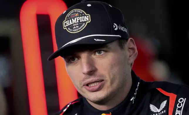 Red Bull driver Max Verstappen, of the Netherlands, conducts an interview after the F1 Las Vegas Grand Prix auto race, Sunday, Nov. 24, 2024, in Las Vegas. (AP Photo/Matt York)