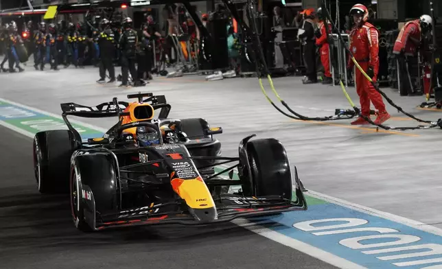 Red Bull driver Max Verstappen, of the Netherlands, drives on pit row during the F1 Las Vegas Grand Prix auto race, Saturday, Nov. 23, 2024, in Las Vegas. (AP Photo/John Locher, Pool)