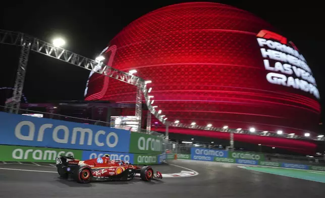 Ferrari driver Carlos Sainz, of Spain, drives during qualifications for the Formula One U.S. Grand Prix auto race, Friday, Nov. 22, 2024, in Las Vegas. (AP Photo/Rick Scuteri)