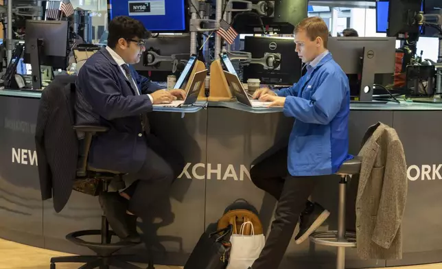 FILE - People work on the New York Stock Exchange trading floor in New York on November 21, 2024. (AP Photo/Ted Shaffrey, File)