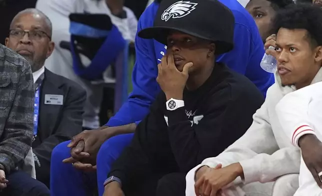 Philadelphia 76ers' Joel Embiid, left, and Kyle Lowry watch from bench during the first half of an NBA basketball game against the Los Angeles Clippers, Sunday, Nov. 24, 2024, in Philadelphia. (AP Photo/Matt Slocum)