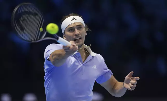 Germany's Alexander Zverev returns to Taylor Fritz of the United States during their semifinal tennis match of the ATP World Tour Finals at the Inalpi Arena in Turin, Italy, Saturday, Nov. 16, 2024. (AP Photo/Antonio Calanni)