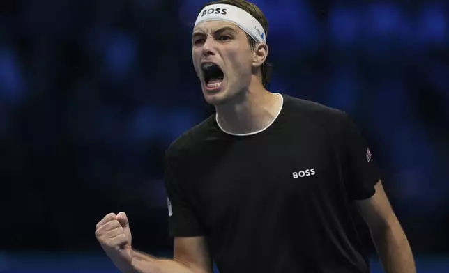 Taylor Fritz of the United States celebrates after winning the ATP World Tour Finals semifinal tennis match against Germany's Alexander Zverevat at the Inalpi Arena in Turin, Italy, Saturday, November 16, 2024. (AP Photo/Antonio Calanni)