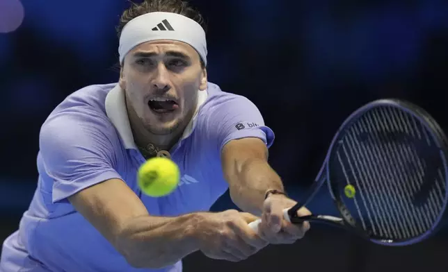 Germany's Alexander Zverev returns to Taylor Fritz of the United States during their semifinal tennis match of the ATP World Tour Finals at the Inalpi Arena in Turin, Italy, Saturday, Nov. 16, 2024. (AP Photo/Antonio Calanni)