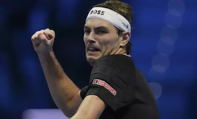 Taylor Fritz of the United States celebrates after winning the ATP World Tour Finals semifinal tennis match against Germany's Alexander Zverevat at the Inalpi Arena in Turin, Italy, Saturday, November 16, 2024. (AP Photo/Antonio Calanni)