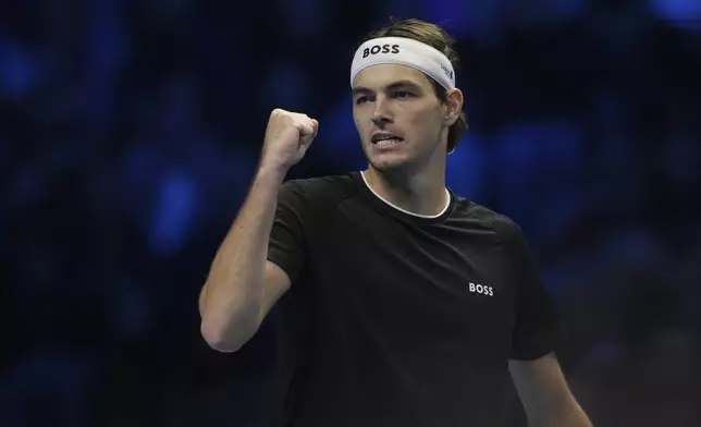 Taylor Fritz of the United States reacts during a semifinal tennis match against Germany's Alexander Zverev at the ATP World Tour Finals at the Inalpi Arena in Turin, Italy, Saturday, Nov. 16, 2024. (AP Photo/Antonio Calanni)