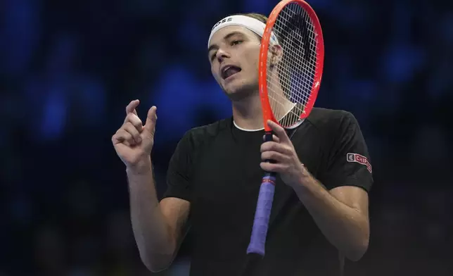 Taylor Fritz of the United States reacts during a semifinal tennis match against Germany's Alexander Zverev at the ATP World Tour Finals at the Inalpi Arena in Turin, Italy, Saturday, Nov. 16, 2024. (AP Photo/Antonio Calanni)