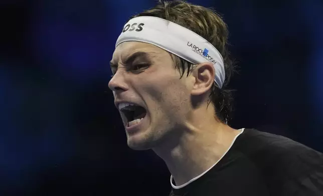 Taylor Fritz of the United States celebrates after winning the ATP World Tour Finals semifinal tennis match against Germany's Alexander Zverevat at the Inalpi Arena in Turin, Italy, Saturday, November 16, 2024. (AP Photo/Antonio Calanni)