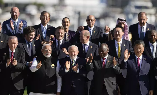 Leaders attending the G20 Summit pose for a group photo in Rio de Janeiro, Monday, Nov. 18, 2024. (AP Photo/Eraldo Peres)