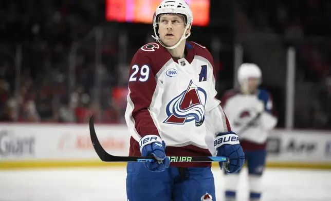 Colorado Avalanche center Nathan MacKinnon (29) looks on during the second period of an NHL hockey game against the Washington Capitals, Thursday, Nov. 21, 2024, in Washington. (AP Photo/Nick Wass)