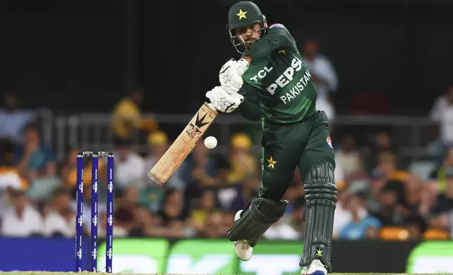 Pakistan's Usman Khan bats during the T20 cricket international between Pakistan and Australia at the Gabba in Brisbane, Australia, Thursday, Nov. 14, 2024. (AP Photo/Tertius Pickard)