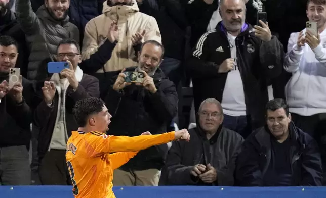 Real Madrid's Federico Valverde celebrates after scoring his side's second goal during a Spanish La Liga soccer match between CD Leganes and Real Madrid in Leganes, outside Madrid, Sunday, Nov. 24, 2024. (AP Photo/Bernat Armangue)