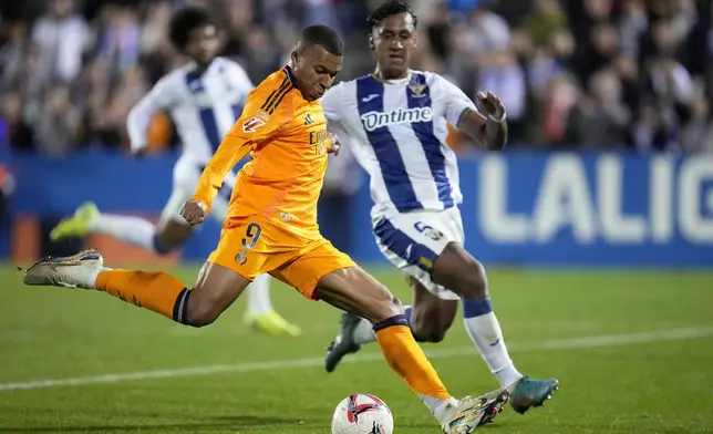 Real Madrid's Kylian Mbappe attempts a shot at goal during a Spanish La Liga soccer match between CD Leganes and Real Madrid in Leganes, outside Madrid, Sunday, Nov. 24, 2024. (AP Photo/Bernat Armangue)