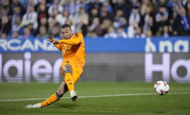 Real Madrid's Kylian Mbappe scores a goal disallowed for offside during a Spanish La Liga soccer match between CD Leganes and Real Madrid in Leganes, outside Madrid, Sunday, Nov. 24, 2024. (AP Photo/Bernat Armangue)