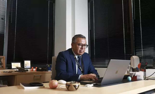 Gustavo Balderas, superintendent of Beaverton School District, works in his office at the district administrative office in Beaverton, Ore., Monday, Nov. 25, 2024. (AP Photo/Amanda Loman)