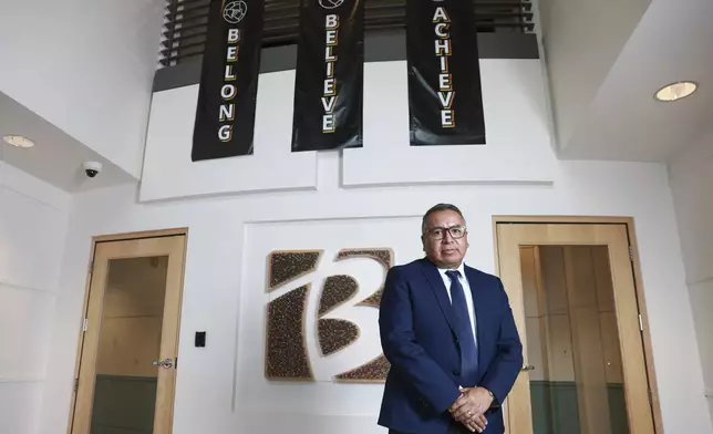 Gustavo Balderas, superintendent of Beaverton School District, stands for a photo in the lobby of the district administrative office in Beaverton, Ore., Monday, Nov. 25, 2024. (AP Photo/Amanda Loman)