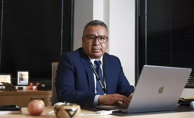 Gustavo Balderas, superintendent of Beaverton School District, works in his office at the district administrative office in Beaverton, Ore., Monday, Nov. 25, 2024. (AP Photo/Amanda Loman)