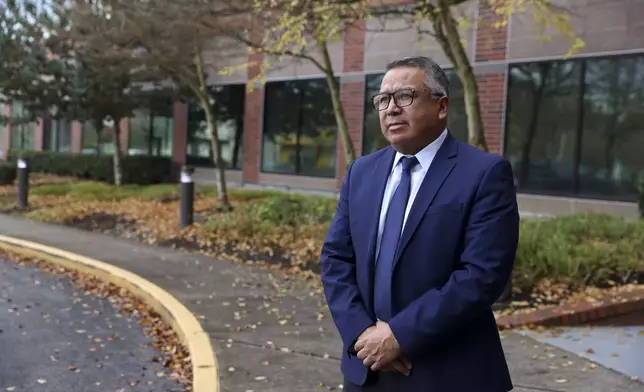 Gustavo Balderas, superintendent of Beaverton School District, stands for a photo outside of the Beaverton school district administrative office in Beaverton, Ore., Monday, Nov. 25, 2024. (AP Photo/Amanda Loman)