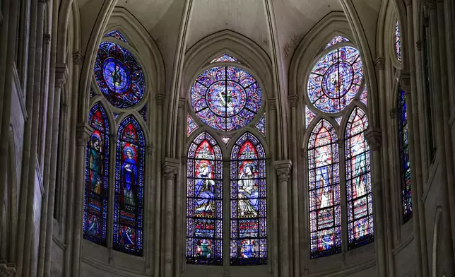 Windows in the heart of Notre-Dame de Paris cathedral are seen while French President Emmanuel Macron visits the restored interiors of the monument, Friday Nov. 29, 2024, in Paris. (Stephane de Sakutin, Pool via AP)