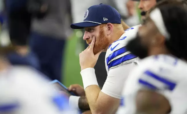 Dallas Cowboys quarterback Cooper Rush sits on the bench late in the second half of an NFL football game against the Philadelphia Eagles in Arlington, Texas, Sunday, Nov. 10, 2024. (AP Photo/Jeffrey McWhorter)