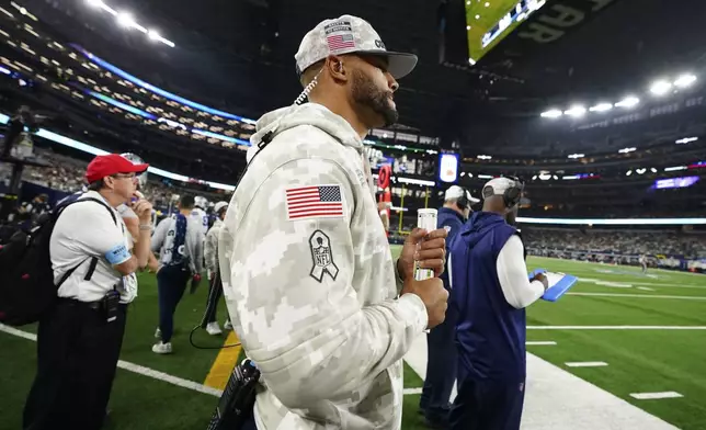 Dallas Cowboys' Dak Prescott watches play against the Philadelphia Eagles in the second half of an NFL football game in Arlington, Texas, Sunday, Nov. 10, 2024. (AP Photo/Jeffrey McWhorter)