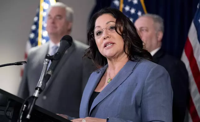 FILE - Rep. Lori Chavez-DeRemer, R-Ore., accompanied by Majority Whip Rep. Tom Emmer, R-Minn., left, and House Majority Leader Rep. Steve Scalise, R-La., right, speaks at a news conference on Capitol Hill in Washington, Jan. 25, 2023. (AP Photo/Andrew Harnik, File)