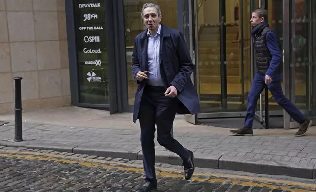 Irish Prime Minister and Fine Gael leader Simon Harris leaves Marconi House after speaking on Newstalk's Pat Kenny show, on the last day of campaigning on the eve of the General Election, in Dublin, Thursday, Nov. 28, 2024. (Brian Lawless/PA via AP)