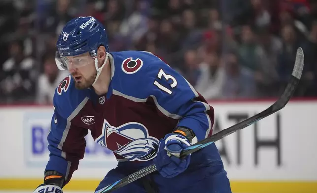 Back after a six-month suspension from the league, Colorado Avalanche right wing Valleri Nichushkin pursues the puck in the first period of an NHL hockey game against the Washington Capitals, Friday, Nov. 15, 2024, in Denver. (AP Photo/David Zalubowski)