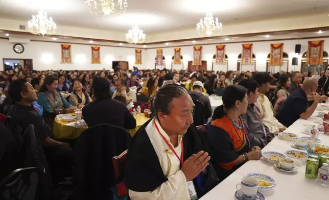 Hundreds attend the 18th birthday and enthronement ceremony for U.S.-born Buddhist lama, Jalue Dorje, at the Tibetan American Foundation of Minnesota in Isanti, Minn., on Saturday, Nov. 9, 2024. (AP Photo/Jessie Wardarski)