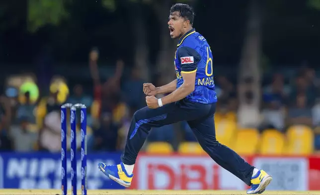 Sri Lanka's Maheesh Theekshana celebrates the wicket of New Zealand's Will Young during the first ODI cricket match between New Zealand and Sri Lanka at Rangiri Dambulla International Stadium in Dambulla, Sri Lanka, Wednesday, Nov. 13, 2024. (AP Photo/Viraj Kothalawala)