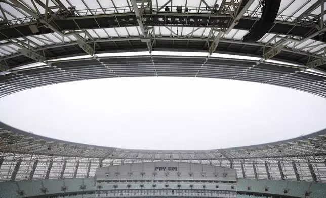 Activists with signs spell out "pay up" for climate finance in the Baku Olympic Stadium during the COP29 U.N. Climate Summit, Thursday, Nov. 14, 2024, in Baku, Azerbaijan. (AP Photo/Sergei Grits)