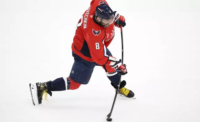 Washington Capitals left wing Alex Ovechkin shoots during the third period of an NHL hockey game against the Pittsburgh Penguins, Friday, Nov. 8, 2024, in Washington. (AP Photo/Nick Wass)