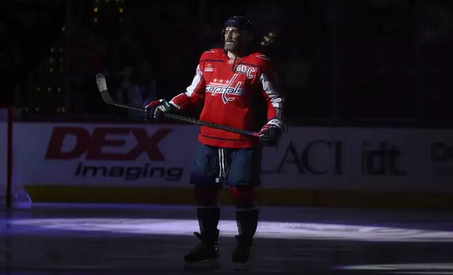 Washington Capitals left wing Alex Ovechkin (8) stands on the ice before an NHL hockey game against the Pittsburgh Penguins, Friday, Nov. 8, 2024, in Washington. (AP Photo/Nick Wass)