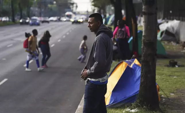 FILE - Jorge Menjivar, from El Salvador, stands outside the Northern Bus Station in Mexico City, Sept. 22, 2023, during his journey north to the U.S. (AP Photo/Marco Ugarte, File)