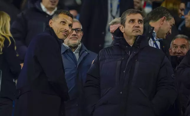 Manchester City chairman Khaldoon Al Mubarak, left, arrives to watch the Champions League opening phase soccer match between Manchester City and Feyenoord at the Etihad Stadium in Manchester, England, Tuesday, Nov. 26, 2024. (AP Photo/Dave Thompson)