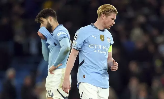 Manchester City's Kevin De Bruyne and Josko Gvardio, left, react after the Champions League opening phase soccer match between Manchester City and Feyenoord at the Etihad Stadium in Manchester, England, Tuesday, Nov. 26, 2024. (Martin Rickett/PA via AP)