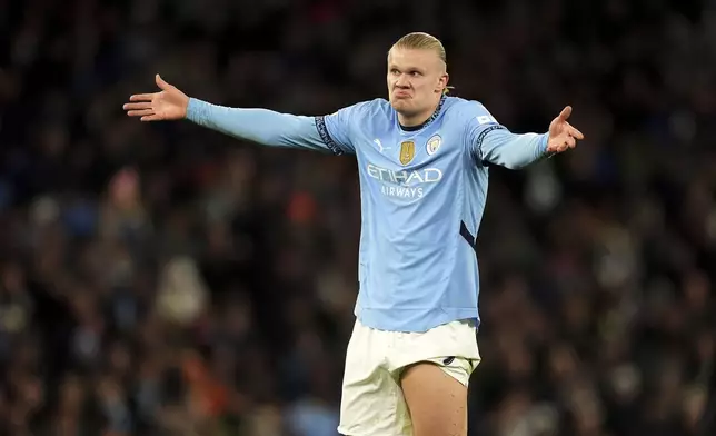 Manchester City's Erling Haaland gestures during the Champions League opening phase soccer match between Manchester City and Feyenoord at the Etihad Stadium in Manchester, England, Tuesday, Nov. 26, 2024. (Martin Rickett/PA via AP)