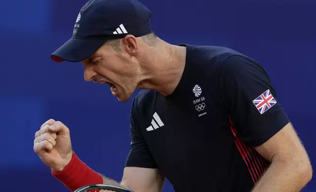 FILE - Andy Murray of Britain reacts after scoring a point against Kei Nishikori and Toro Daniel of Japan during the men's doubles tennis competition, at the 2024 Summer Olympics, July 28, 2024, in Paris, France. (AP Photo/Andy Wong, File)