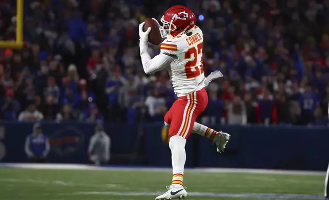 Kansas City Chiefs defensive back Chamarri Conner (27) intercepts a pass during the first half of an NFL football game against the Buffalo Bills Sunday, Nov. 17, 2024, in Orchard Park, N.Y. (AP Photo/Jeffrey T. Barnes)