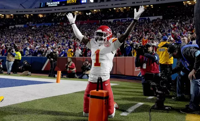 Kansas City Chiefs wide receiver Xavier Worthy (1) celebrates after scoring during the first half of an NFL football game against the Buffalo Bills Sunday, Nov. 17, 2024, in Orchard Park, N.Y. (AP Photo/Julia Demaree Nikhinson)