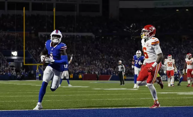 Buffalo Bills wide receiver Curtis Samuel scores past Kansas City Chiefs safety Bryan Cook (6) during the second half of an NFL football game Sunday, Nov. 17, 2024, in Orchard Park, N.Y. (AP Photo/Julia Demaree Nikhinson)