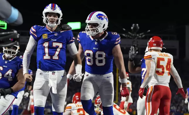 Buffalo Bills quarterback Josh Allen (17) is congratulated by teammate Dawson Knox (88) after scoring on a 26-yard run during the second half of an NFL football game against the Kansas City Chiefs Sunday, Nov. 17, 2024, in Orchard Park, N.Y. (AP Photo/Julia Demaree Nikhinson)