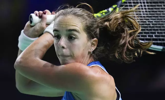 Italy's Lucia Bronzetti competes against Slovakia's Viktoria Hruncakova during the Billie Jean King Cup final at the Martin Carpena Sports Hall in Malaga, southern Spain, Wednesday, Nov. 20, 2024. (AP Photo/Manu Fernandez)