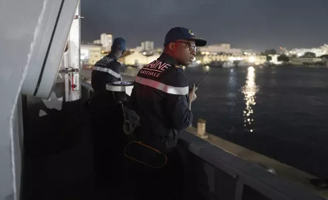 Senegalese sailors on the patrol vessel Niani attend a mission to search for illegal migrant boats near the coast of Dakar, Senegal, Saturday, Nov.16, 2024. (AP Photo/Sylvain Cherkaoui)