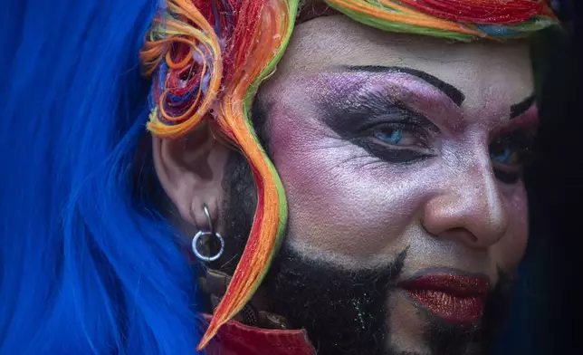 A performer poses for a photo during the 29th LGBTI+ Rio Pride Parade along Copacabana beach in Rio de Janeiro, Sunday, Nov. 24, 2024. (AP Photo/Bruna Prado)