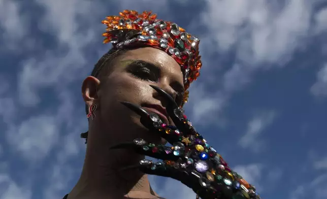 A man performs during the 29th LGBTI+ Rio Pride Parade along Copacabana beach in Rio de Janeiro, Sunday, Nov. 24, 2024. (AP Photo/Bruna Prado)